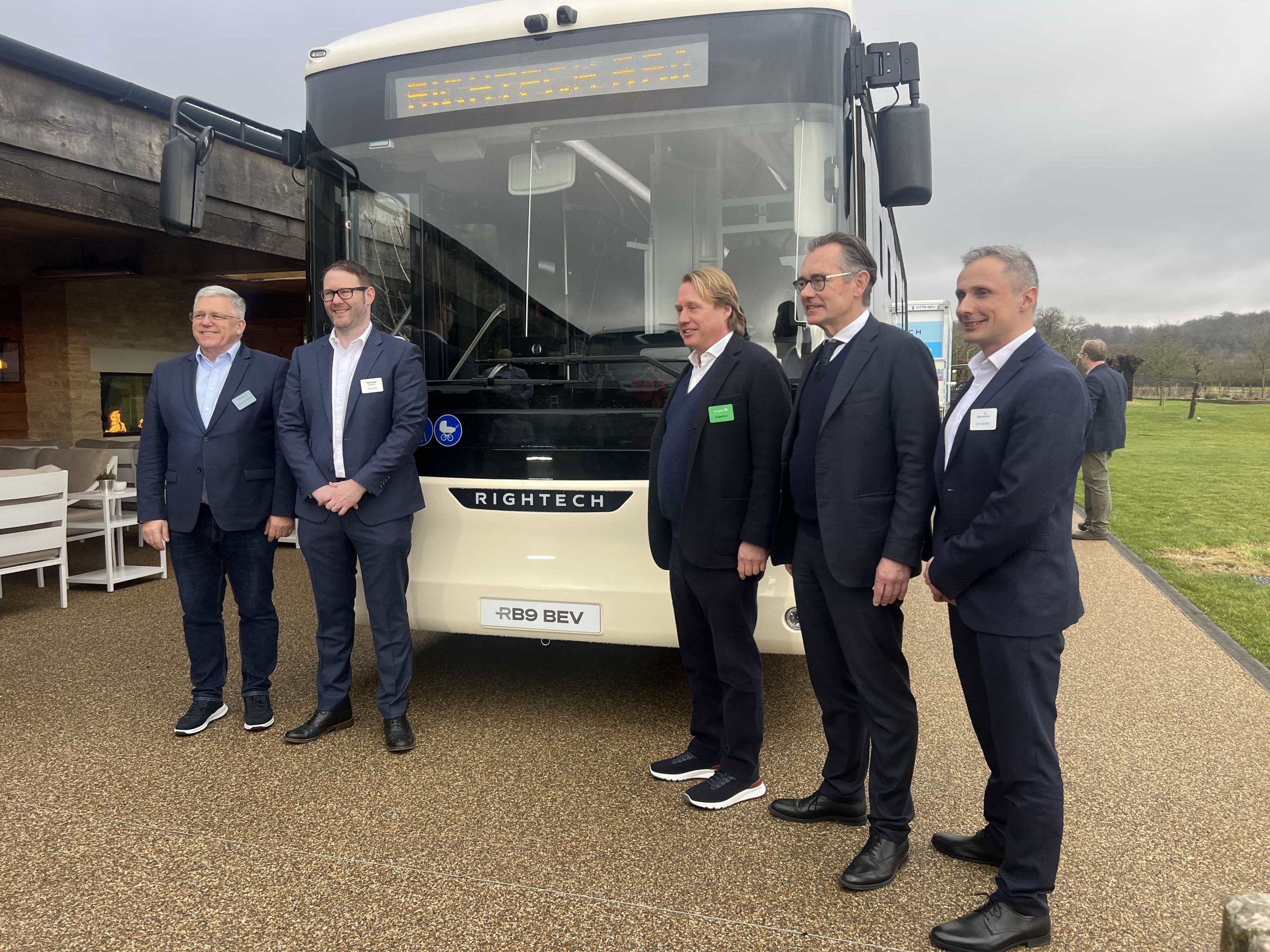 Image of Wrightbus leadership in front of the new RB9 bus delivered in partnership with King Long